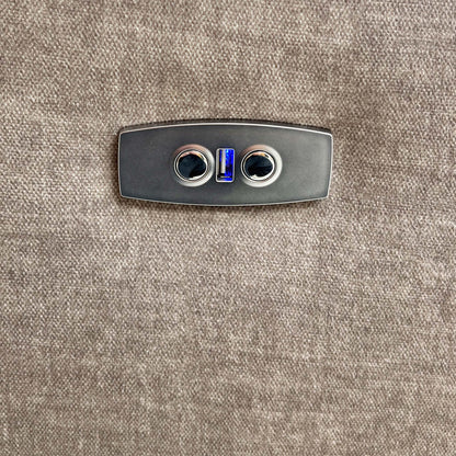 Close-up of the power recline control button located on the side of the armrest.