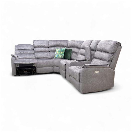 Side profile of the Savoy Charcoal Velvet corner sofa showing its high back design.