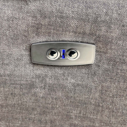 Close-up of the power recline control button located on the side of the armrest.