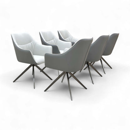 Angled view of the Portofino Fixed Dining Chair in Two-Tone Grey Faux Leather, highlighting the modern design.