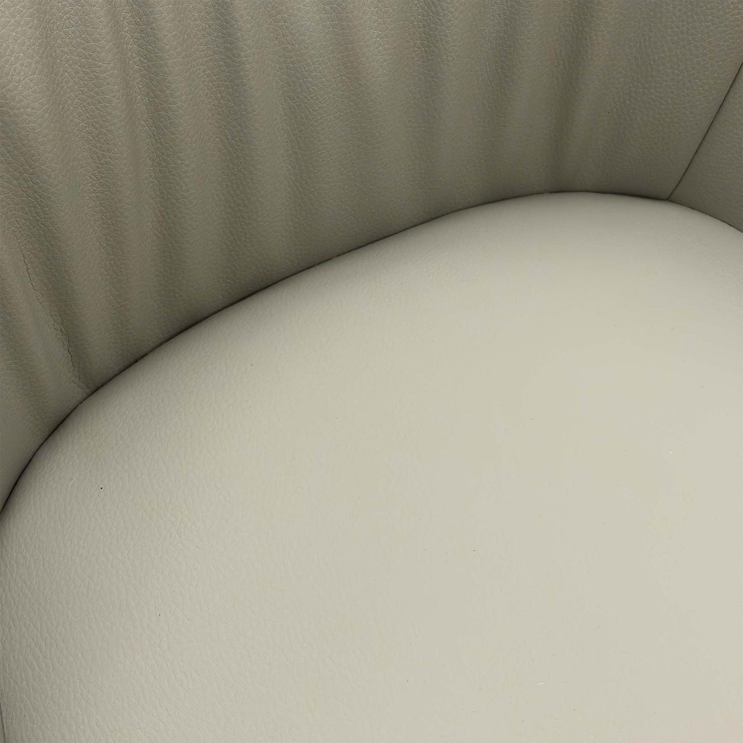 Close-up texture shot of the two-tone grey faux leather upholstery on the Portofino dining chair.