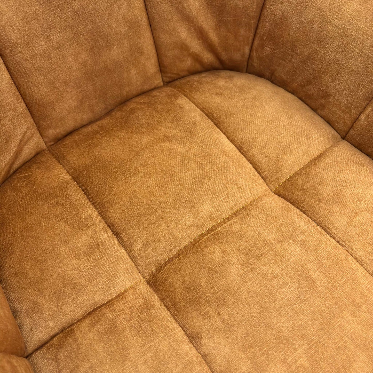 Close-up texture shot of the plush Rust Orange Velvet upholstery on the 'Jade' Swivel Dining Chair.