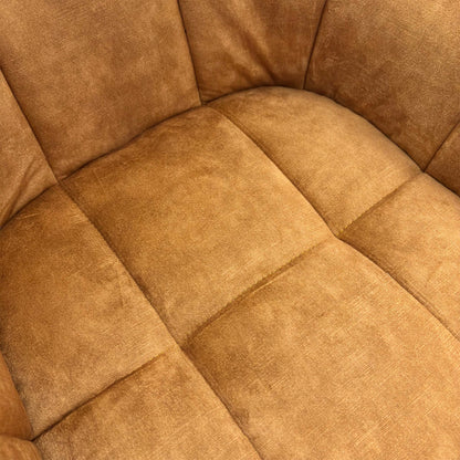 Close-up texture shot of the plush Rust Orange Velvet upholstery on the 'Jade' Swivel Dining Chair.