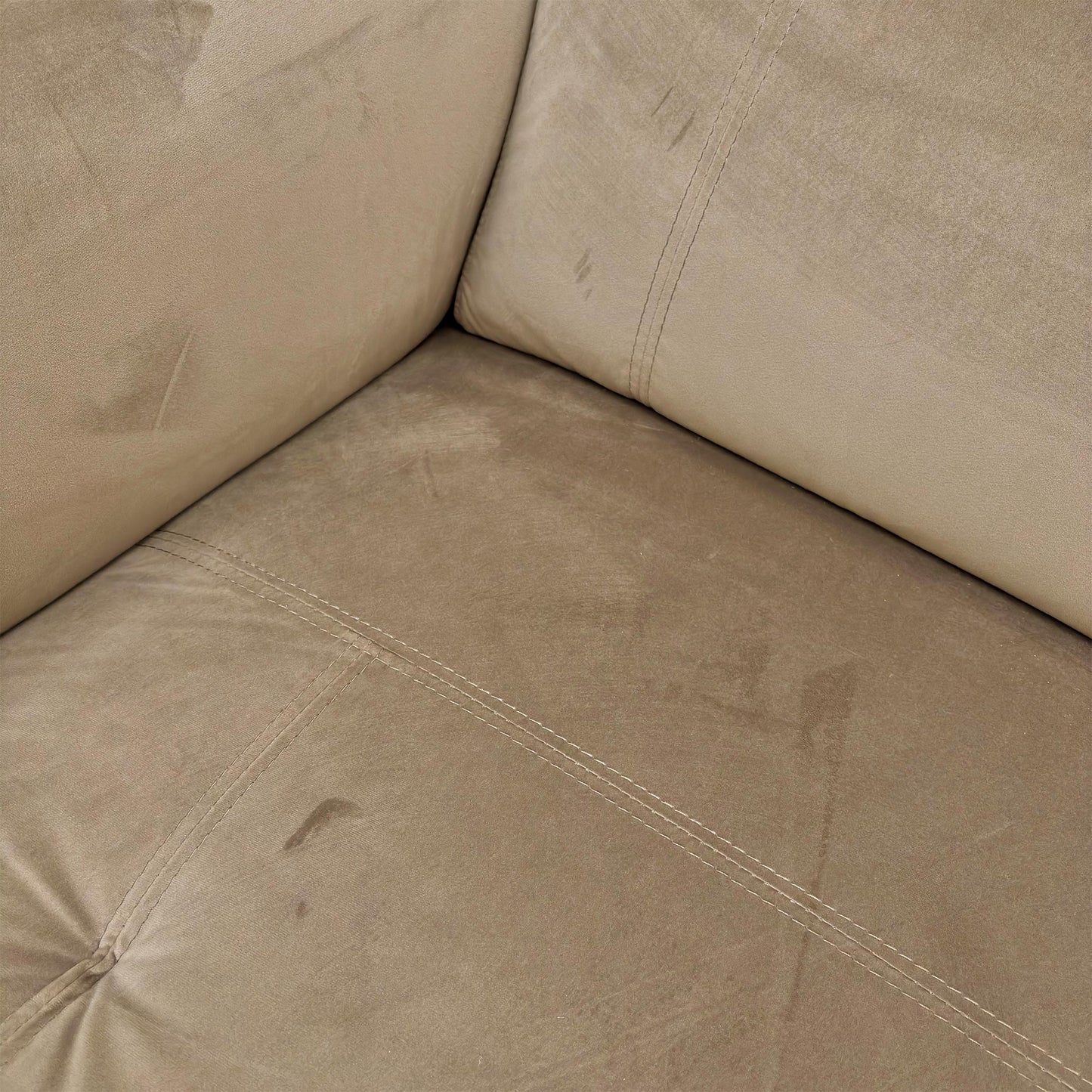 Close-up shot of the sumptuous Opulence Cedar Velvet fabric texture of the 'Moet' sofa.