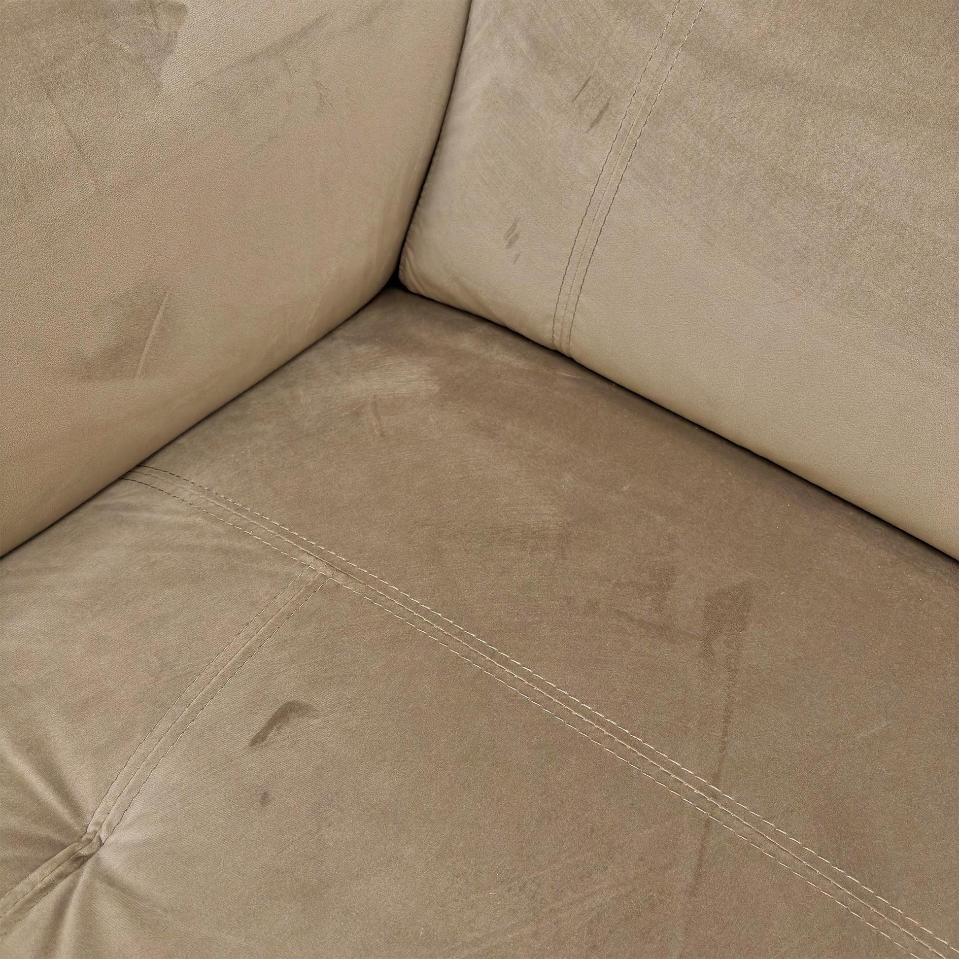Close-up shot of the sumptuous Opulence Cedar Velvet fabric texture of the 'Moet' sofa.