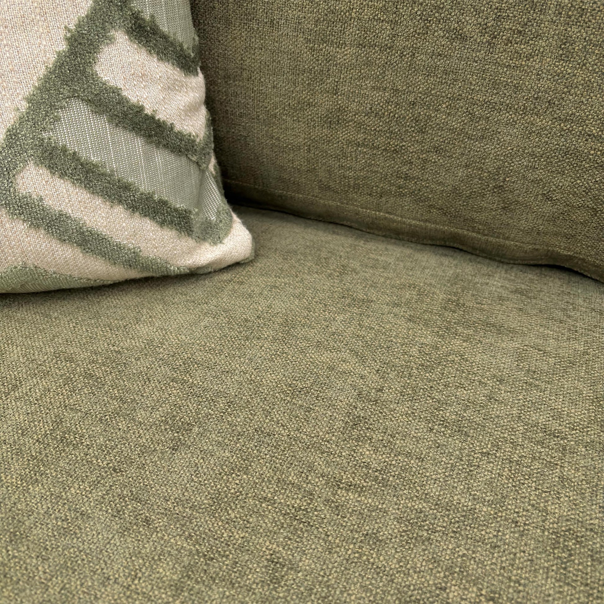 Close-up of the 'Jackson' Armchair in Fern Green Chenille, showcasing the deep cushioning, reversible seat cushion, and rounded arms.