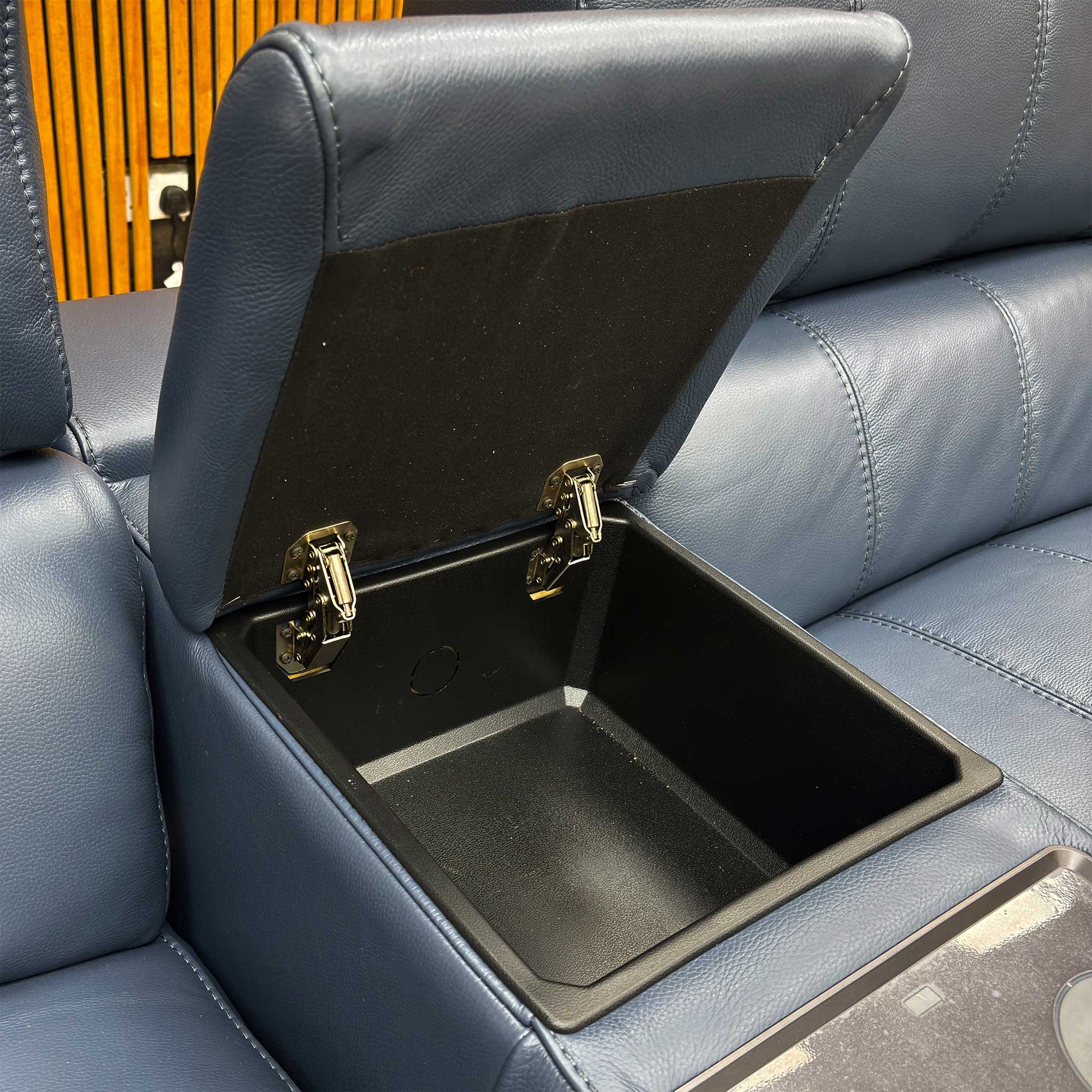 'Homestage' 3 Seater Sofa with the central media console open, revealing the entertainment controls, cup holders, and storage.