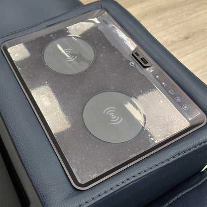 Close-up on the media console panel of the 'Homestage' sofa, showing the power buttons for recline/headrest and the USB/USB-C charging ports.