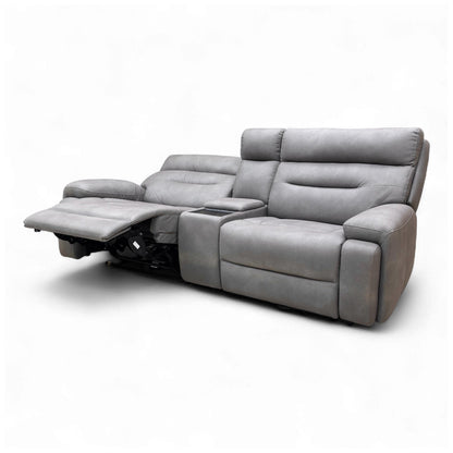 Detailed view of the control button panel on the side of the seat, used to activate the power recliner, power headrest, and massage function.