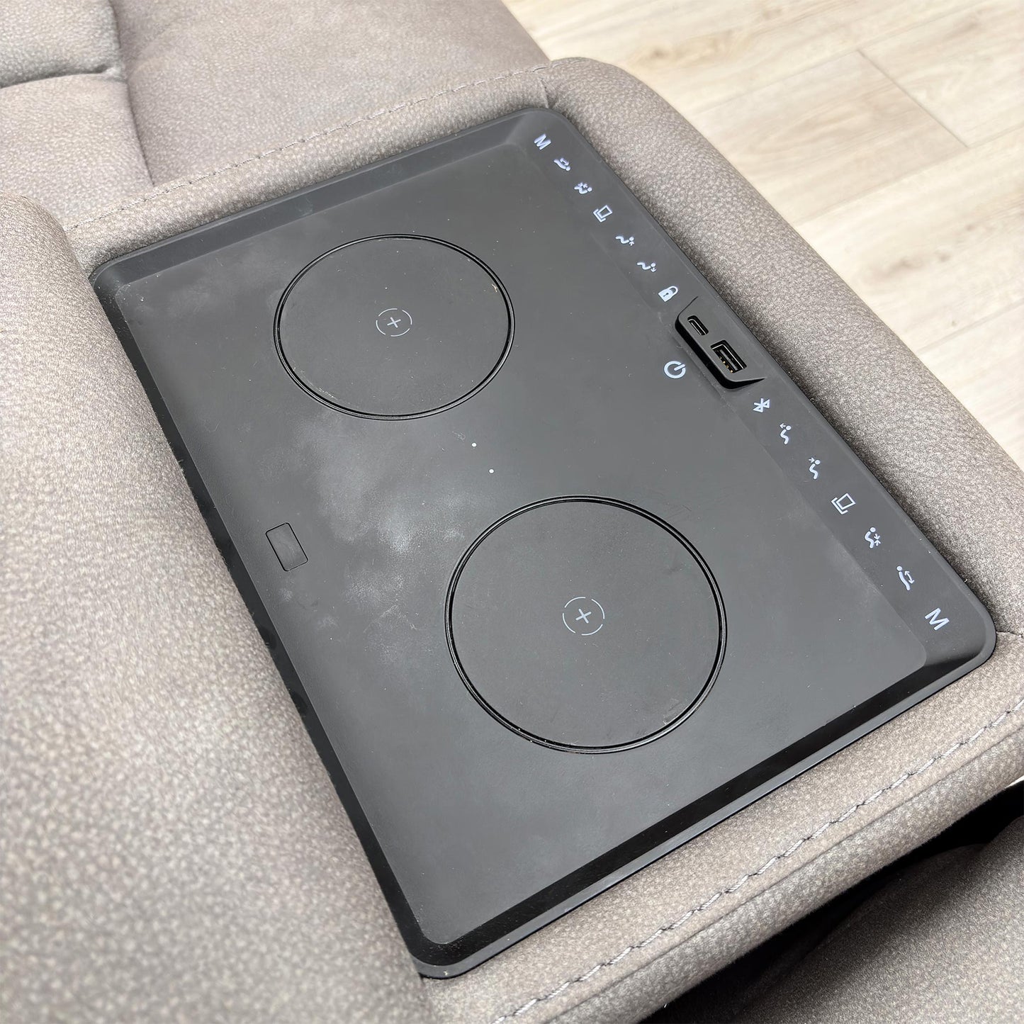 Close-up of the central media console area, showing the cup holders, power control panel, and USB/USB-C charging ports.