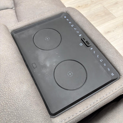 Close-up of the central media console area, showing the cup holders, power control panel, and USB/USB-C charging ports.