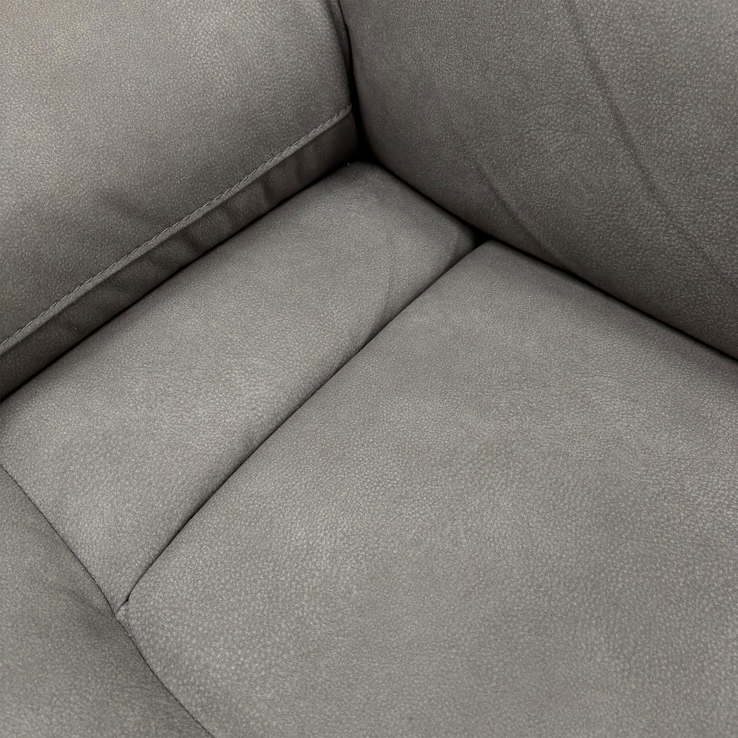 Close-up of the 'Cinemax' sofa showing the plush, padded armrest and the fabric texture.