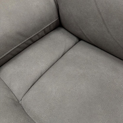 Close-up of the 'Cinemax' sofa showing the plush, padded armrest and the fabric texture.