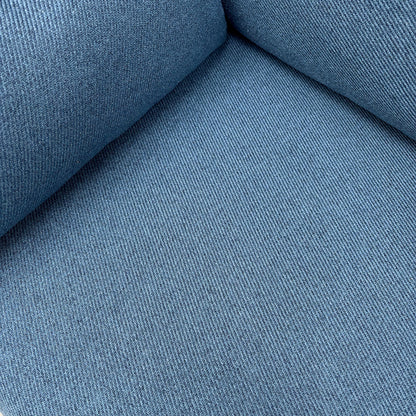 Close-up of the navy blue woven fabric texture on the ‘Wren’ sofa, showing the medium-firm seat cushion and piping detail.