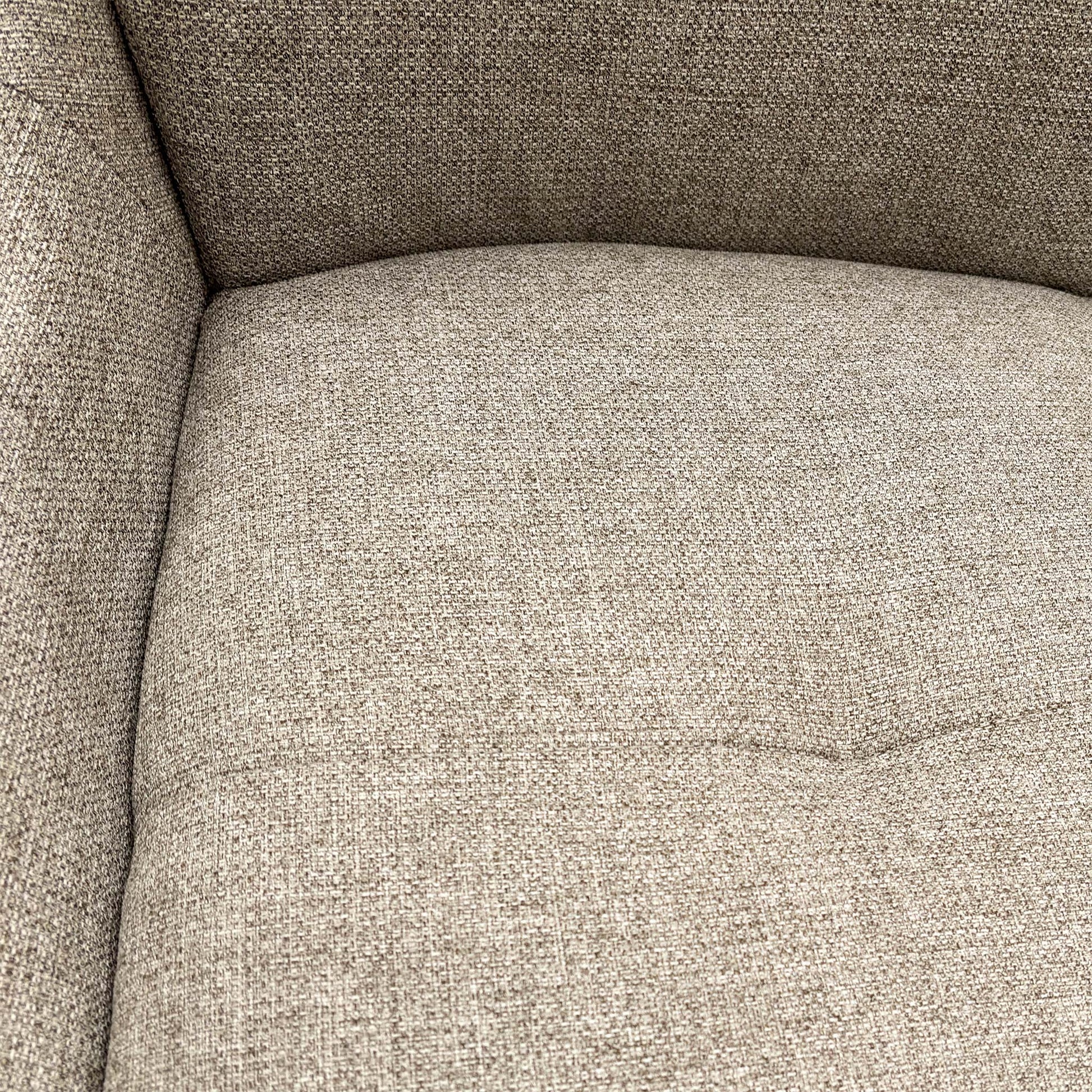 close view of a single chair focusing on the seat and base.