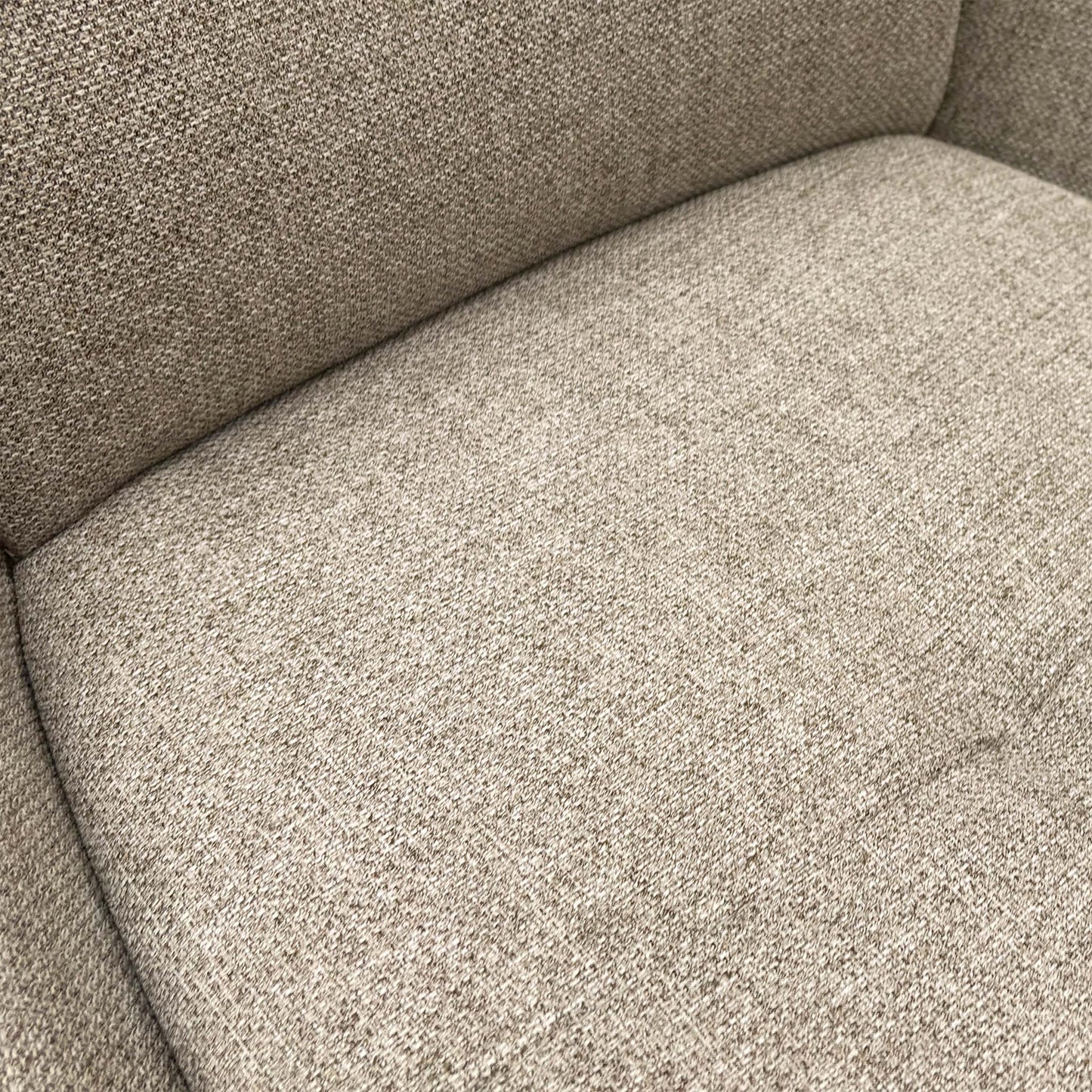 close view of a single chair focusing on the seat and base.