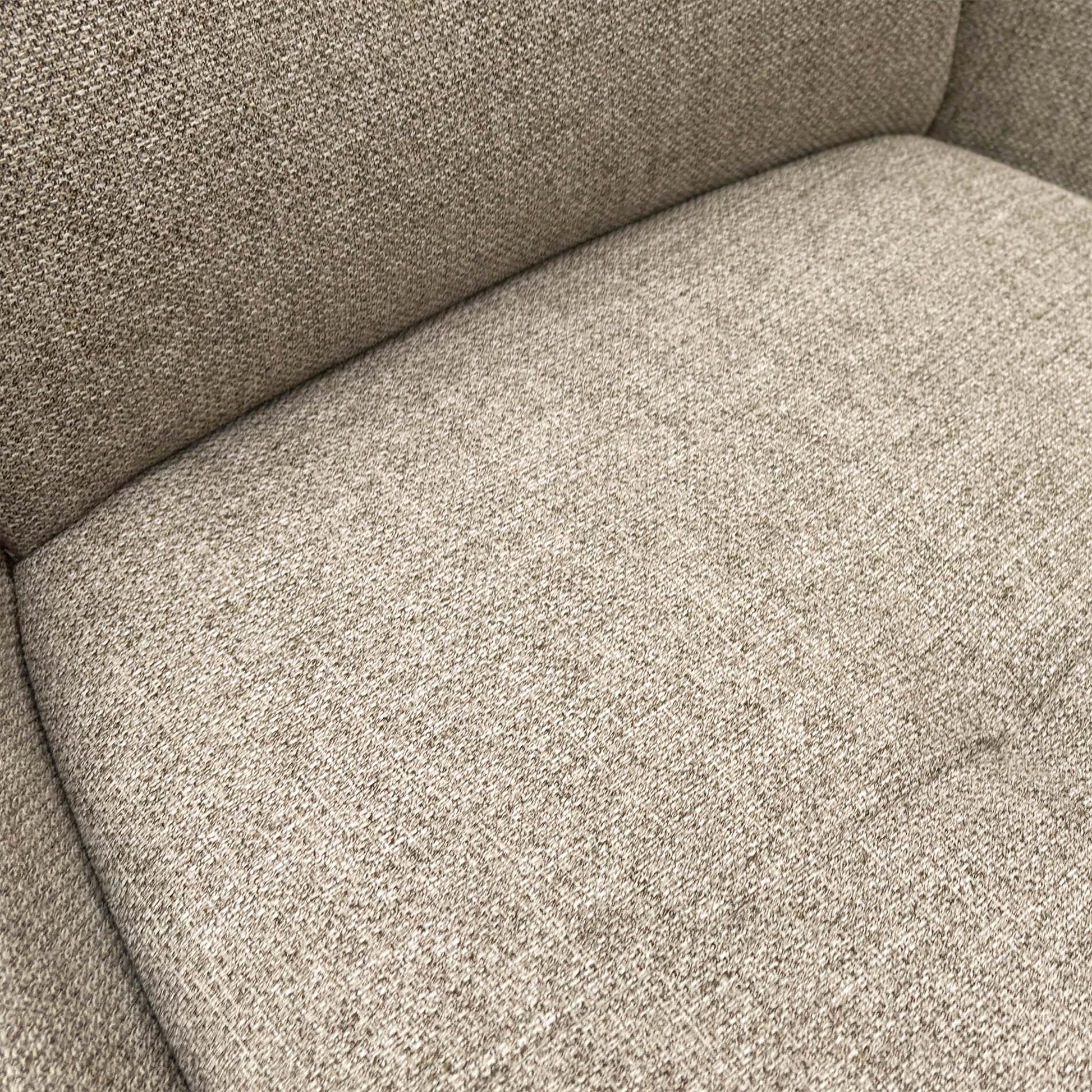 close view of a single chair focusing on the seat and base.