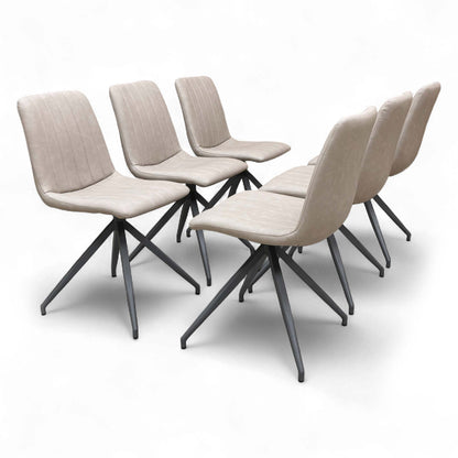 Two Taupe Faux Leather Dining Chairs side-by-side.