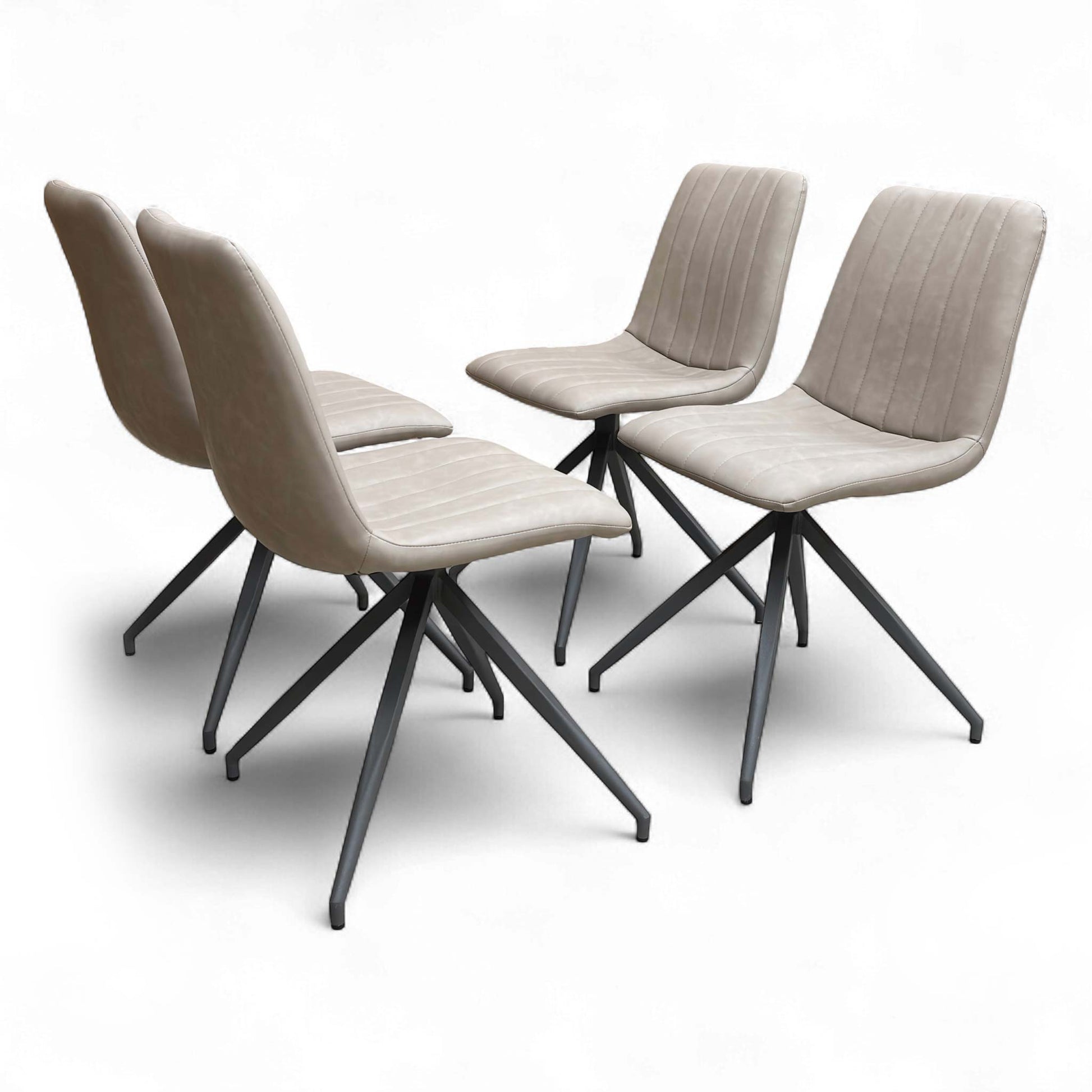 Two Taupe Faux Leather Dining Chairs side-by-side.