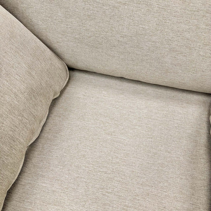 Detailed close-up of the Novak Biscuit soft tight weave fabric, illustrating the texture and color of the upholstery.