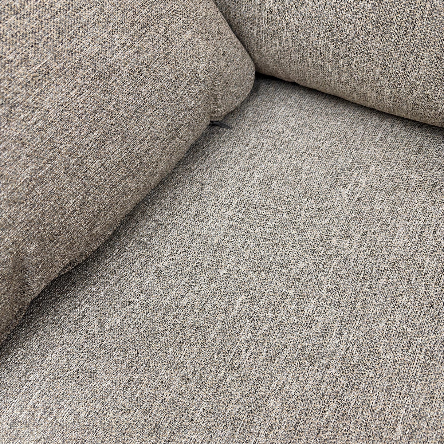 Detailed close-up of the Orm Silver tight weave fabric upholstery, highlighting the texture and sloped arm design.