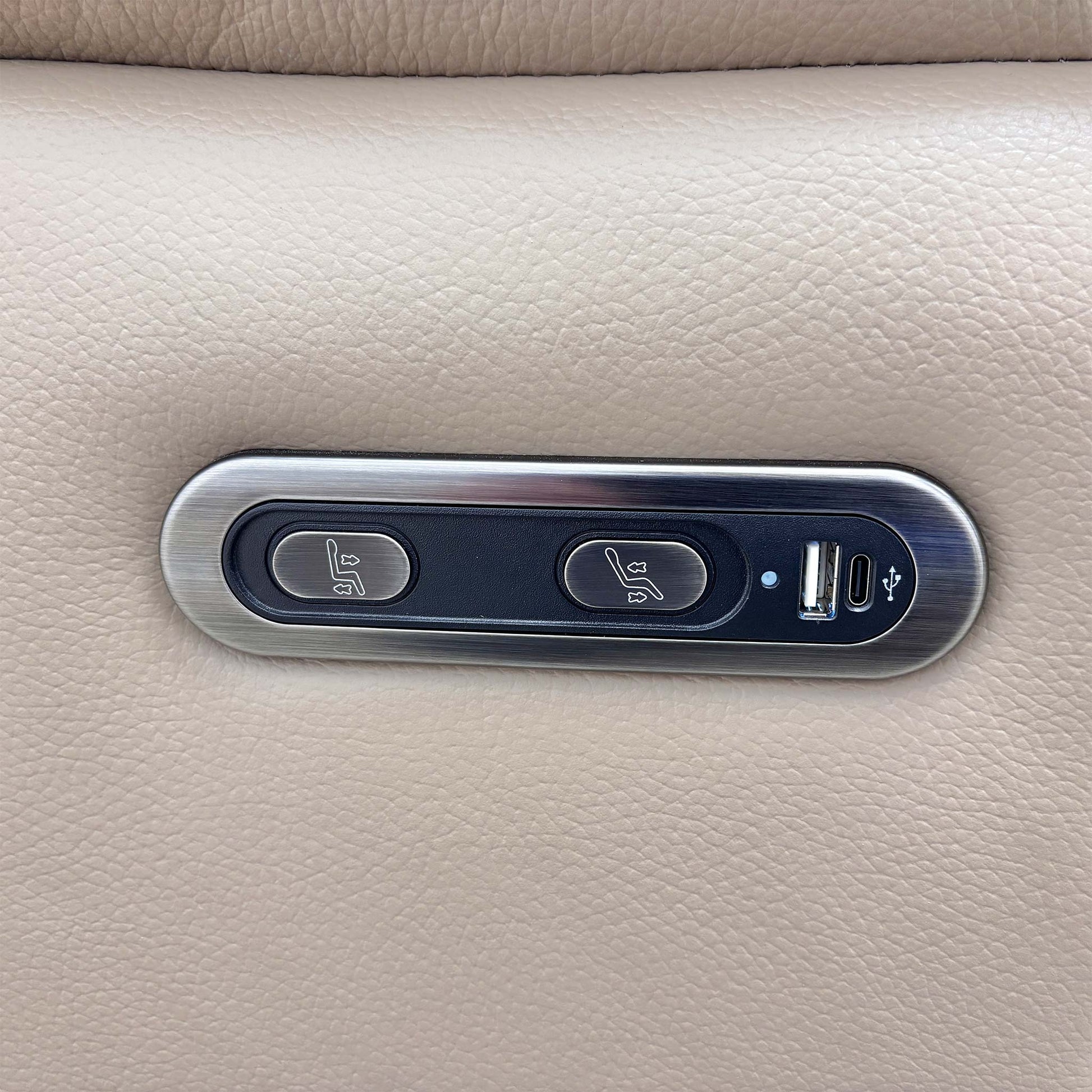 Close-up of the easy-to-use control button panel for the electric power recliner mechanism, typically located on the side of the sofa.