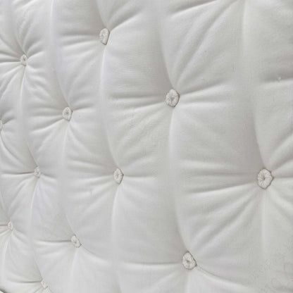 Close-up of the quilted top and tufting.