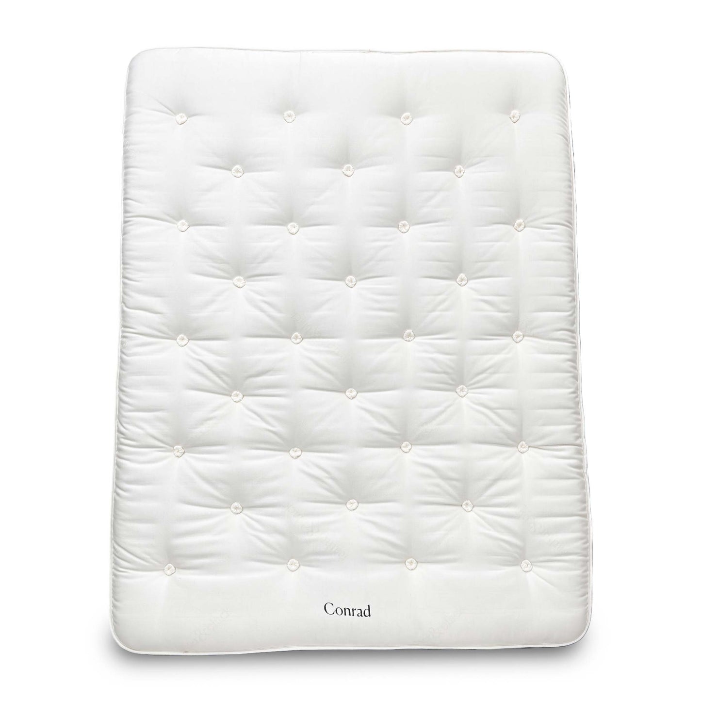 Full view of the King-size Harrison Spinks 'Conrad' 15750 Pocket Spring Mattress, featuring a luxurious white tufted top and firm vertical side stitching, displayed on a wooden base.