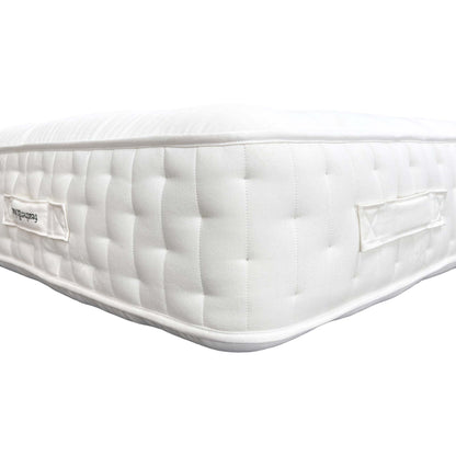 Close-up shot of the mattress border, showing the handles, ventilation, and the durable, upholstered fabric detailing.