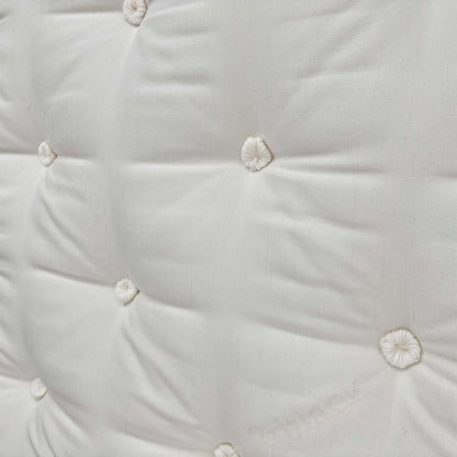 Close-up of the quilted top and tufting.