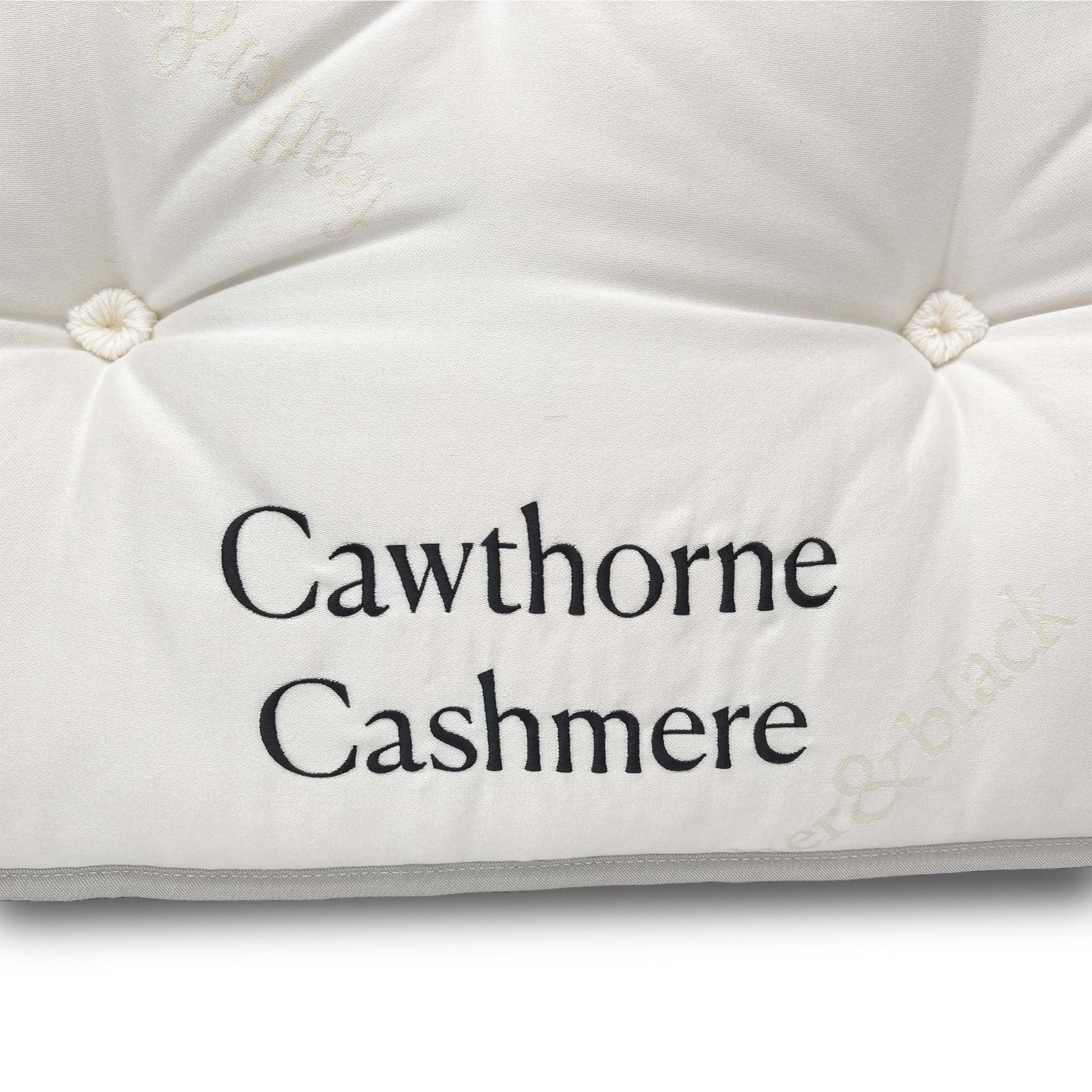 Close-up of the strong, upholstered turning handles on the mattress side, designed to assist with rotating the deep-fill mattress.