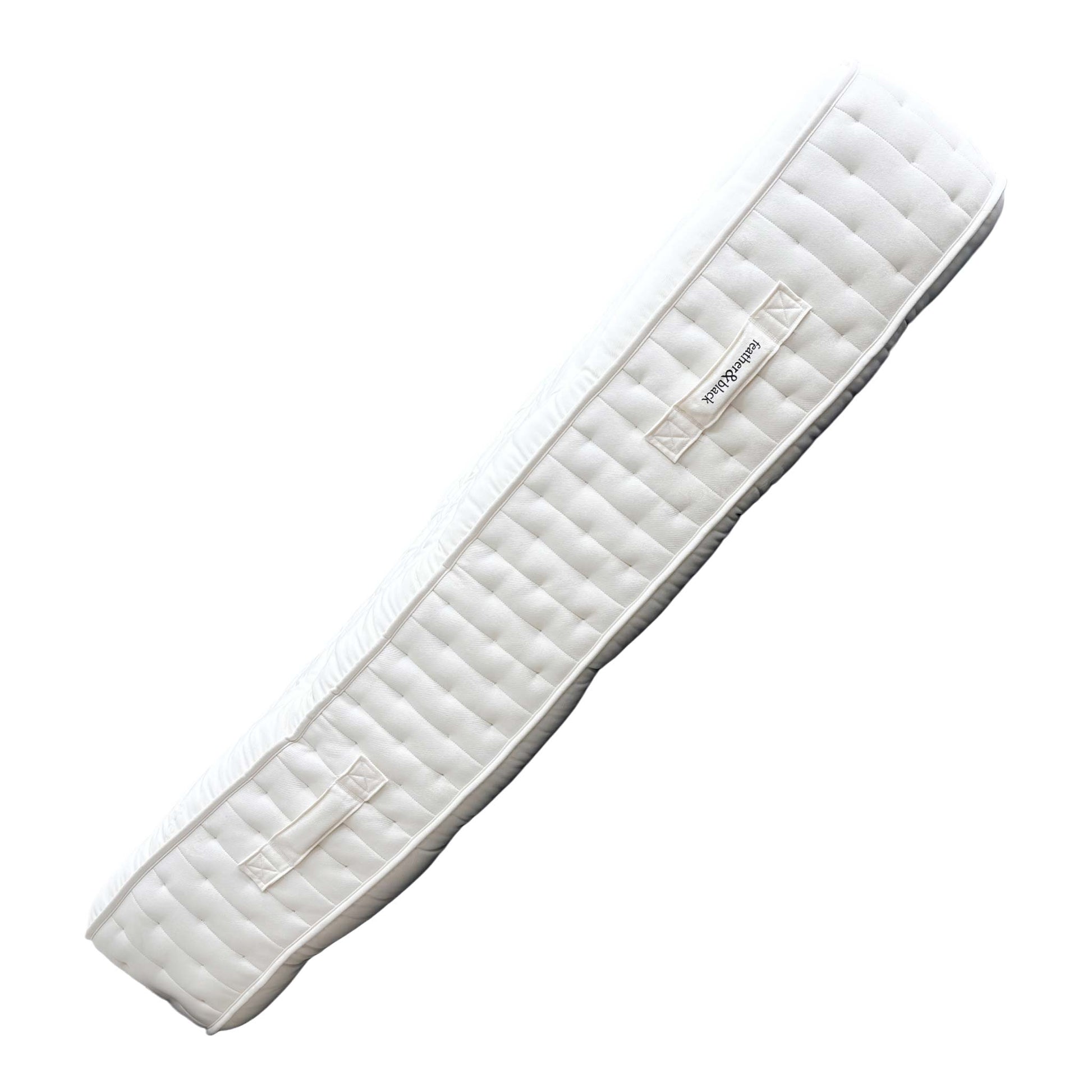 Angled view of the Byron mattress, highlighting its exceptional 36 cm depth, quality side ticking, and robust, hand-stitched borders.