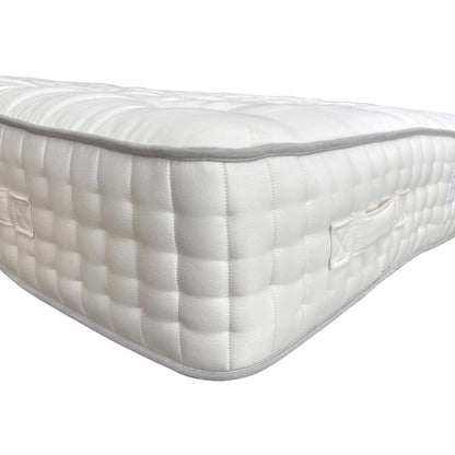 Close-up shot illustrating the Split Tension feature, showing the distinct difference between the Soft and Medium comfort sides of the King mattress.