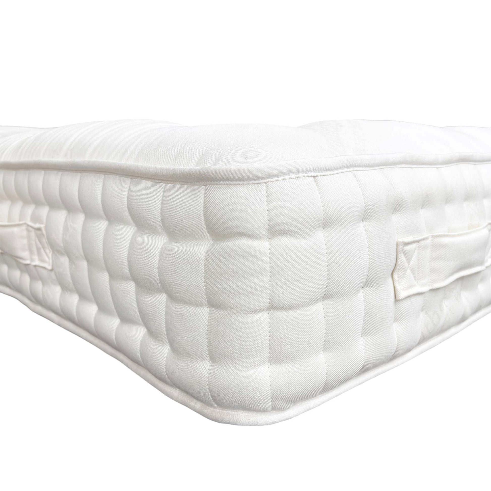 Side view of the mattress on a bed base, showing the depth.