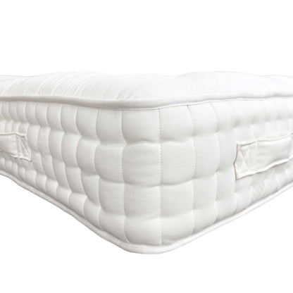 Side view of the mattress on a bed base, showing the depth.