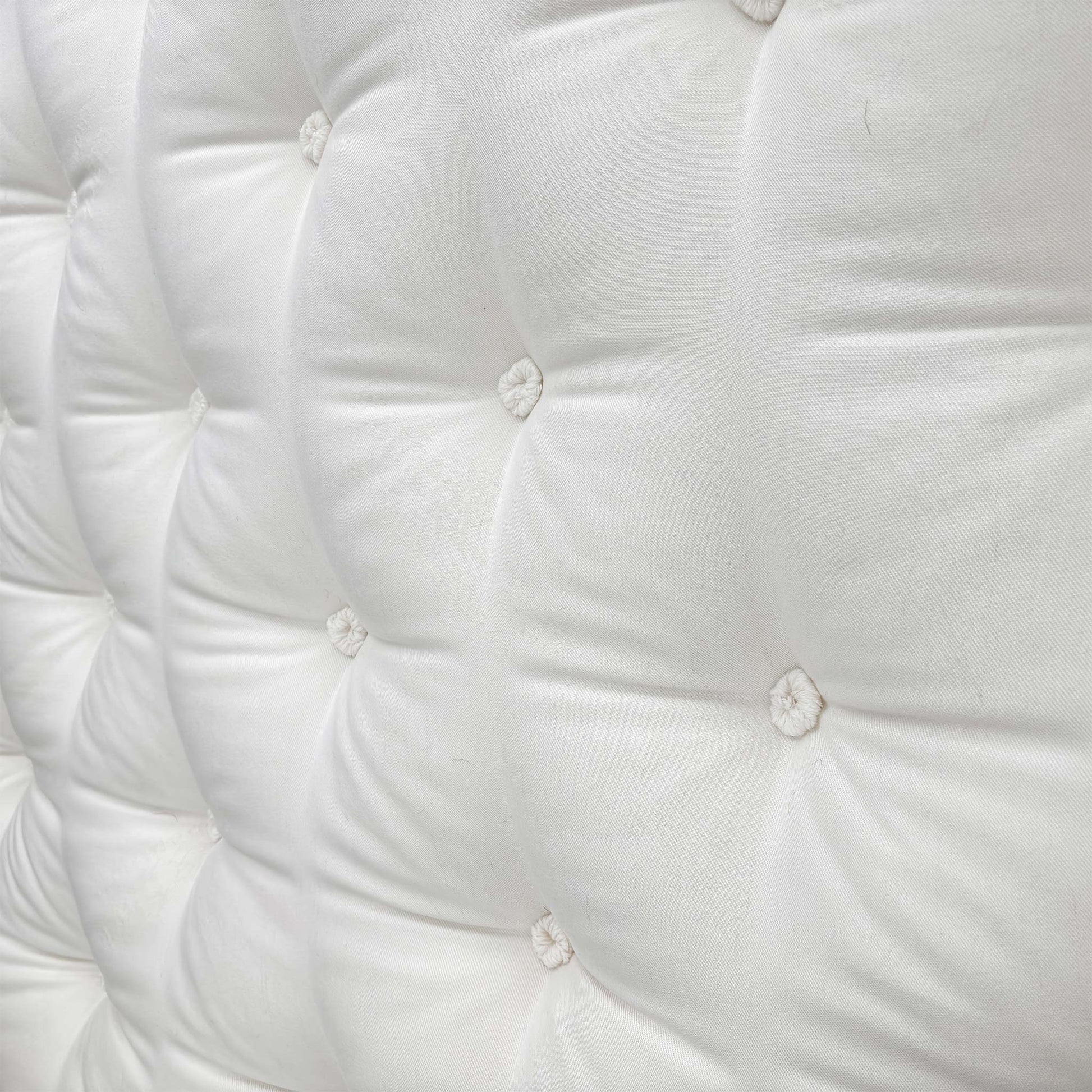 Close-up of the mattress corner showing the stitching/handle.