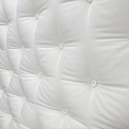 Close-up of the mattress corner showing the stitching/handle.