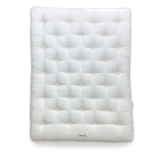 Full shot of the Harrison Spinks Owen King-size mattress, showcasing the quilted top and side handles.