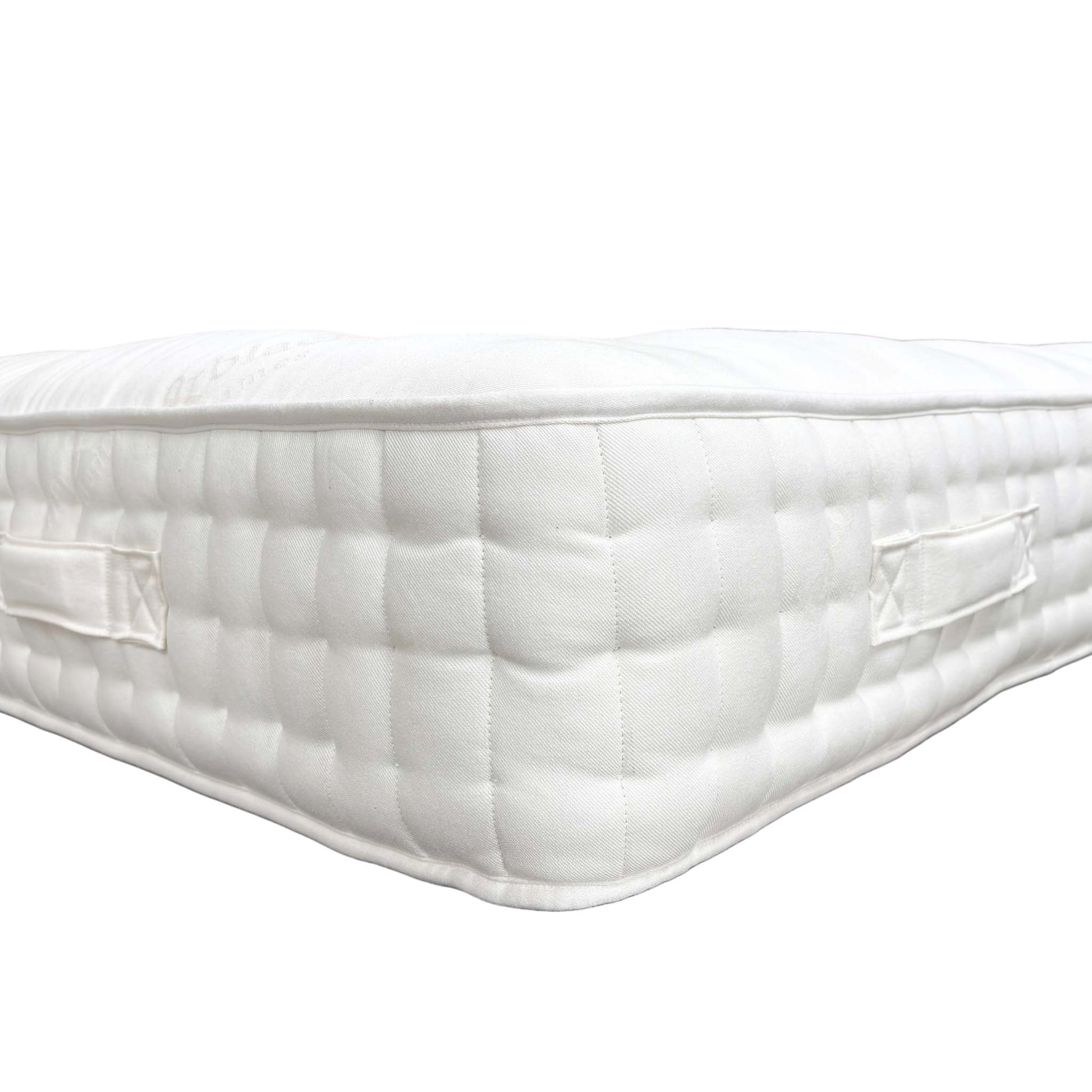 Detailed view of the sturdy, stitched handles on the side of the mattress, designed for easy rotation and movement.