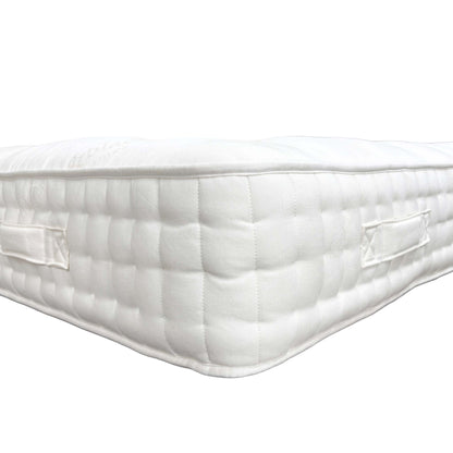 Detailed view of the sturdy, stitched handles on the side of the mattress, designed for easy rotation and movement.