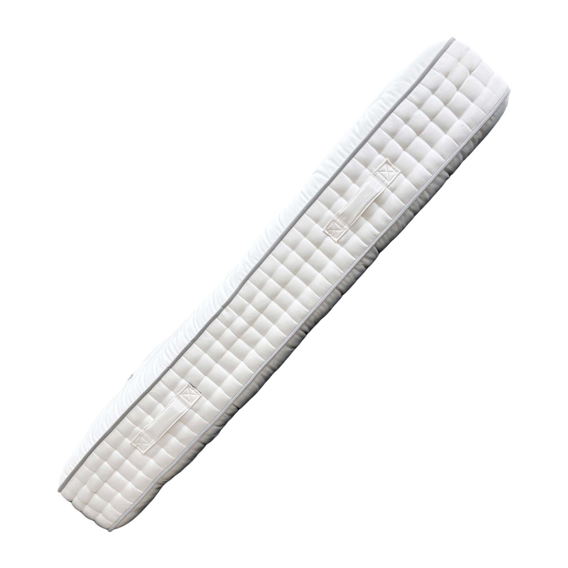 Angled close-up of the surface texture and tufting.