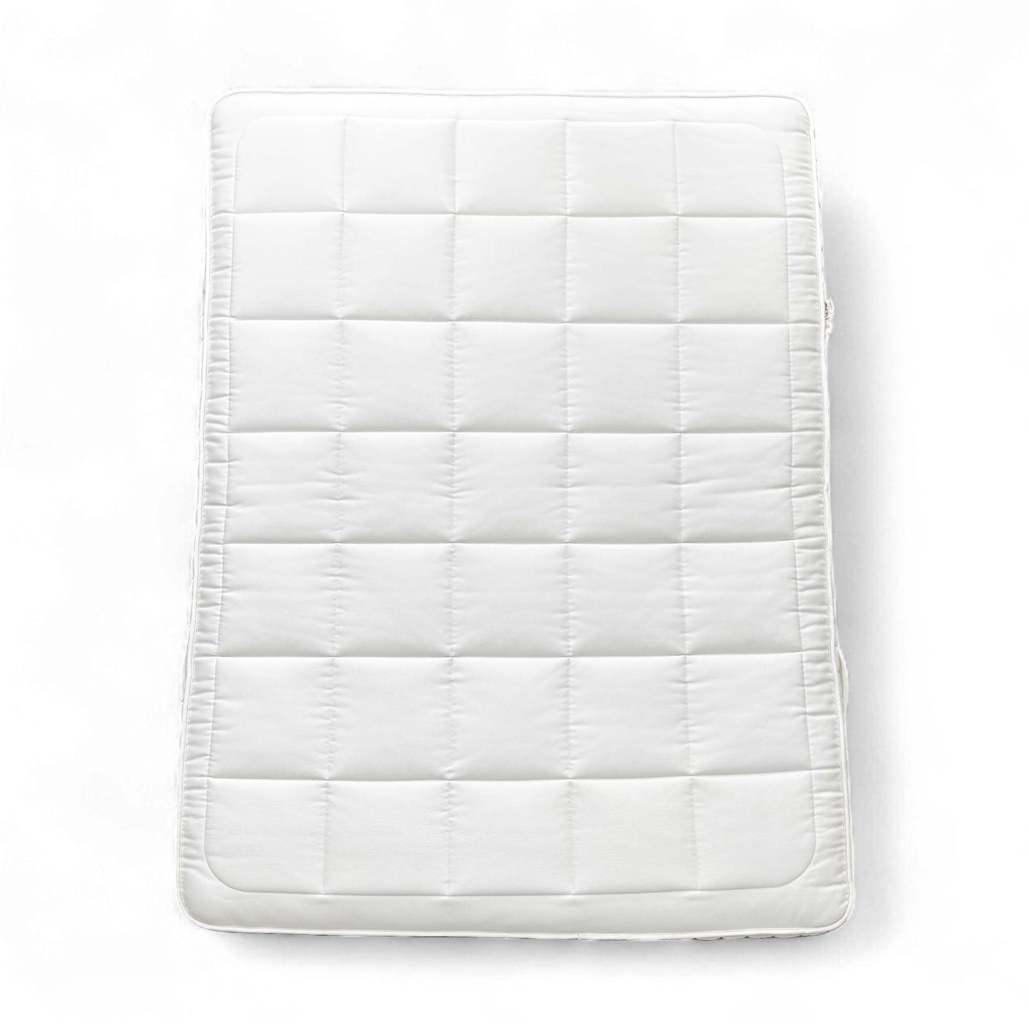 Full view of the mattress on a bed base, top-down perspective.