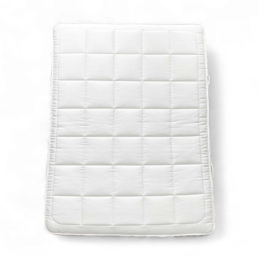 Full view of the mattress on a bed base, top-down perspective.