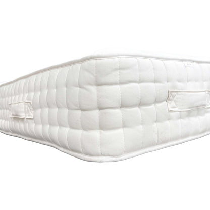 Side view of the mattress on a bed base, showing the depth.