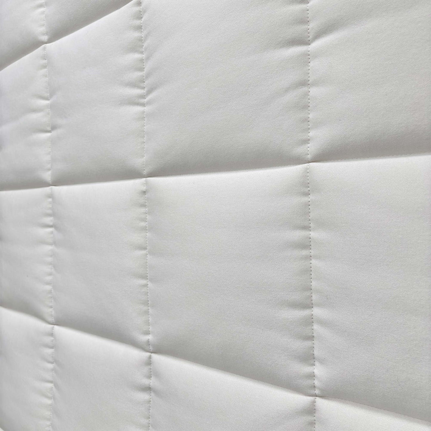 Close-up of the mattress corner showing the stitching/handle.