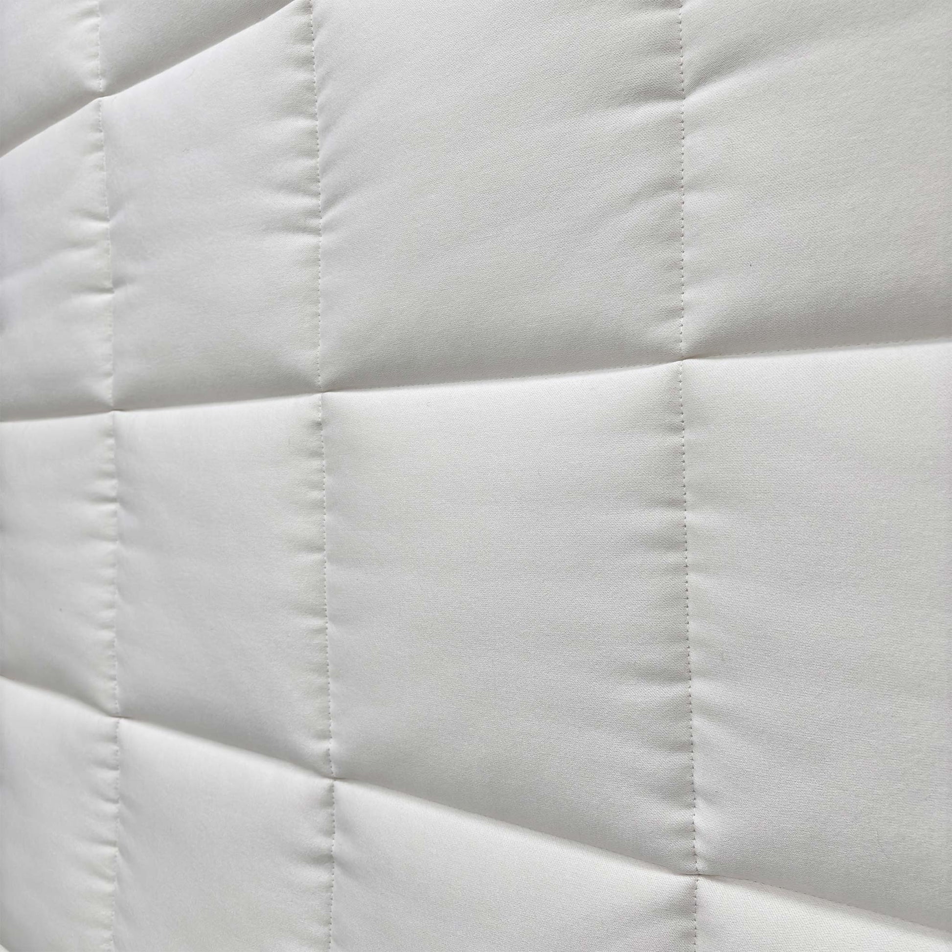 Close-up of the mattress corner showing the stitching/handle.