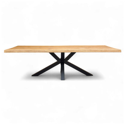 Full front view of the Bodahl Njord 01 Oiled Solid Oak 260cm Dining Table, highlighting the dramatic raw edge and the metal star base.