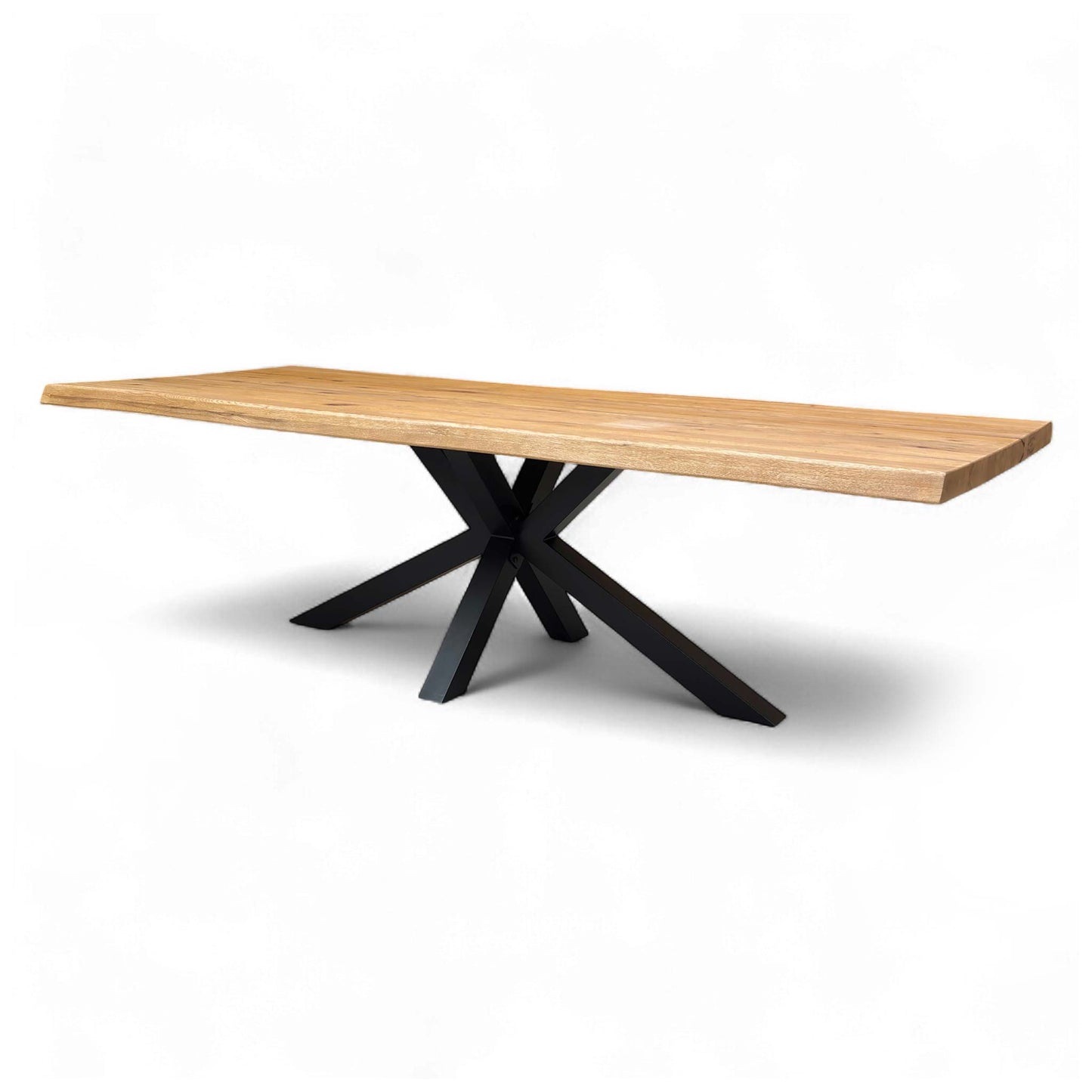 Low-angle view of the table, focusing on the stability and geometric design of the metal star base and its secure attachment to the solid oak top.