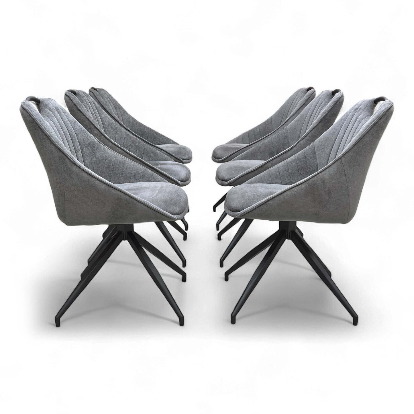 An angled view showing a group of chairs around a dining table (or arranged as a set).