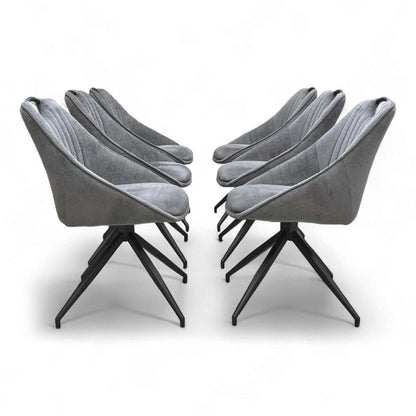 An angled view showing a group of chairs around a dining table (or arranged as a set).